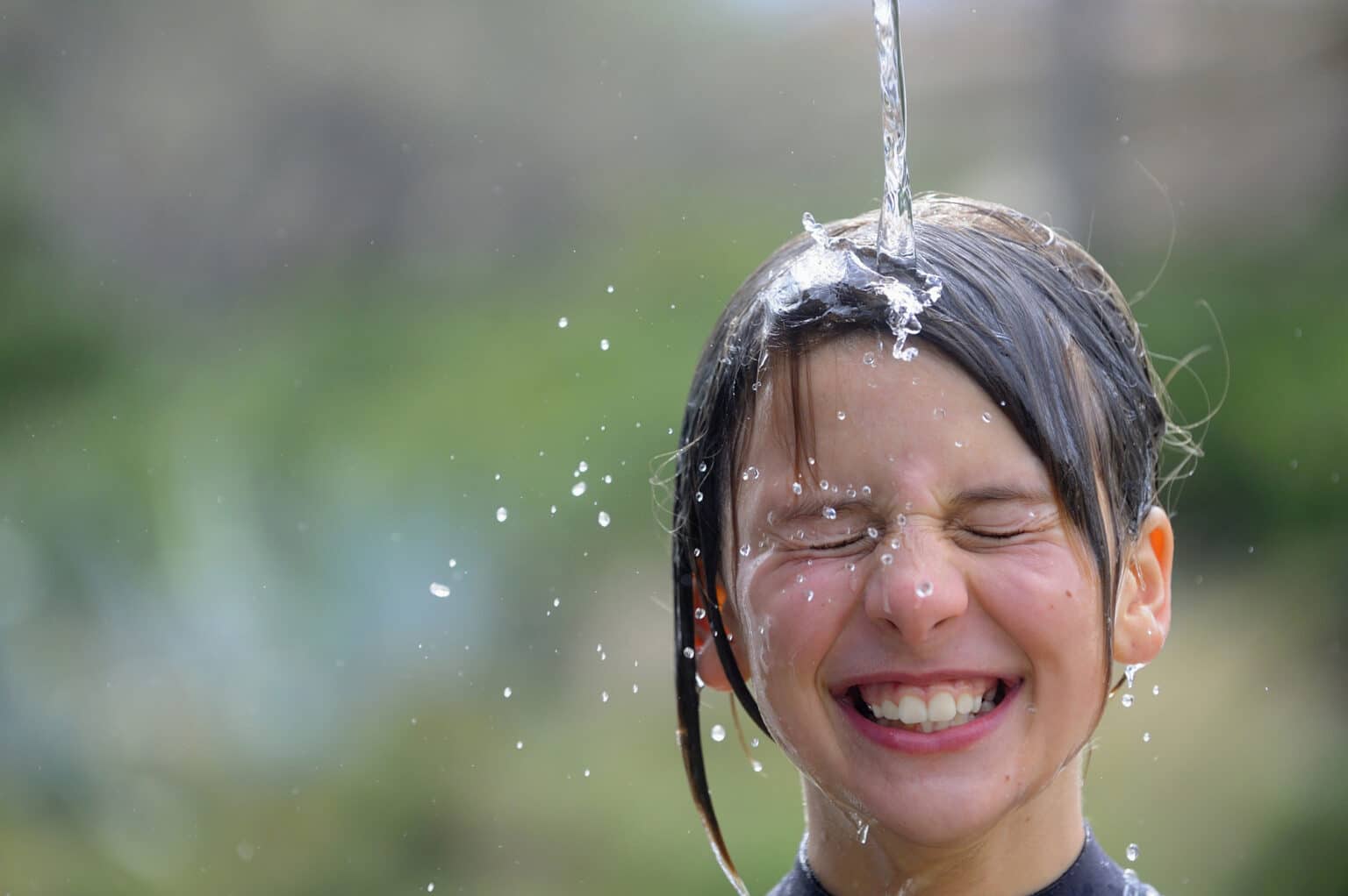 Child plays in water