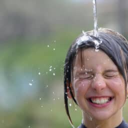 Child plays in water