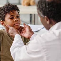 Young boy gets throat examined