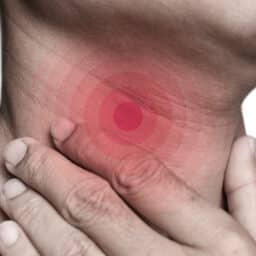 Red circles superimposed on a person's throat, indicating pain or sore throat.